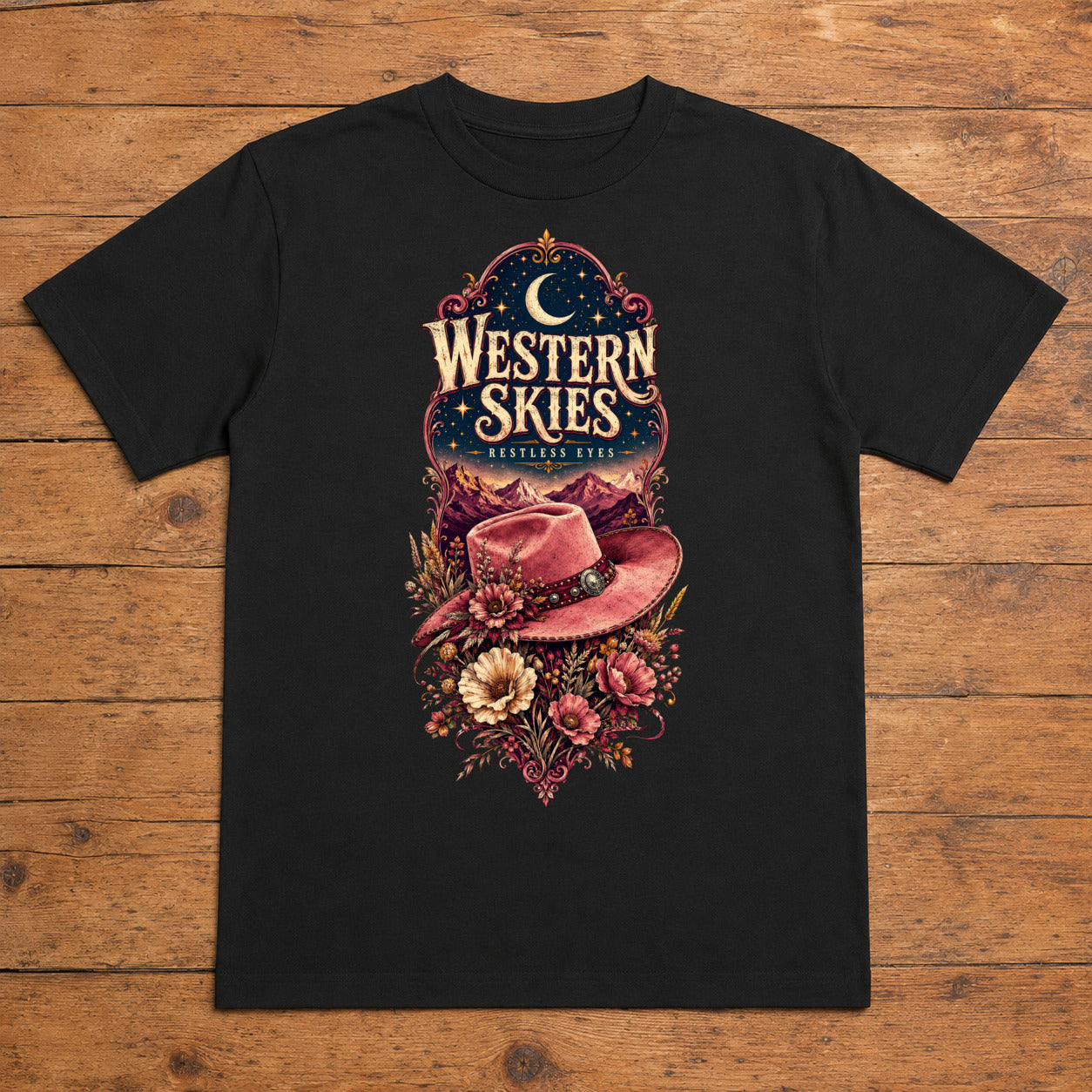 Western Skies Restless Eyes black cowgirl western T-shirt flat lay with large back print